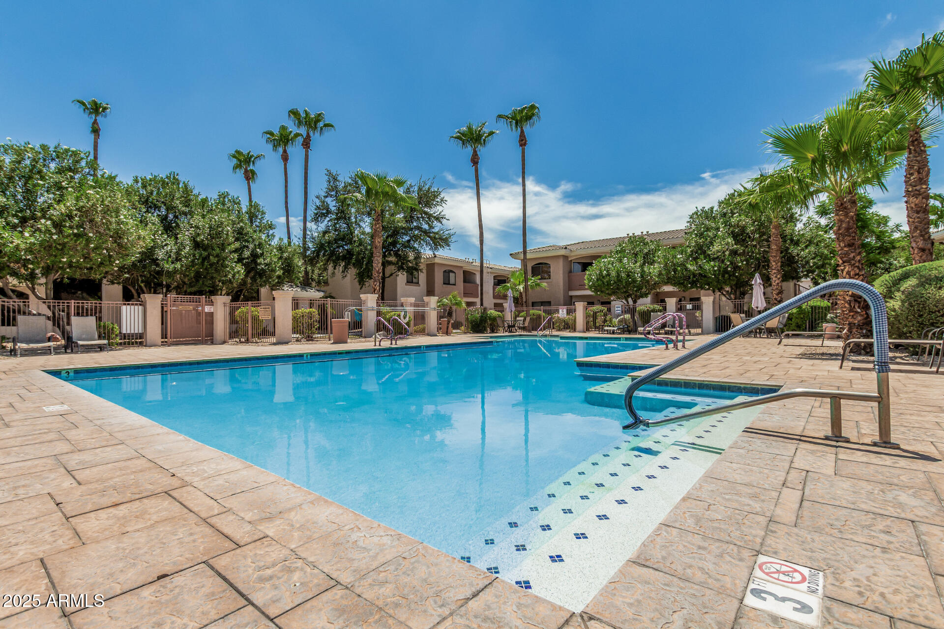 10030 West Indian School Road, Unit 255 Phoenix, AZ 85037 - Photo 23 of 26 a view of a swimming pool with a patio