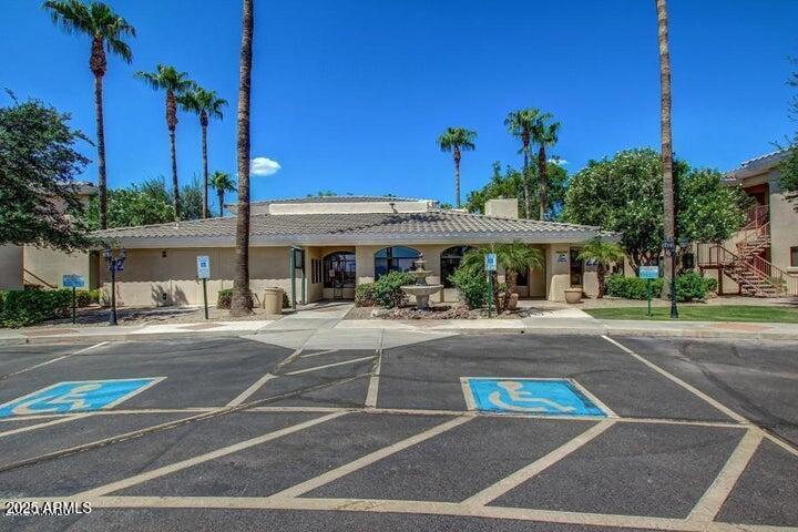 10030 West Indian School Road, Unit 255 Phoenix, AZ 85037 - Photo 3 of 26 a view of a food mall next to a road