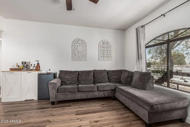 a living room with furniture and a large window