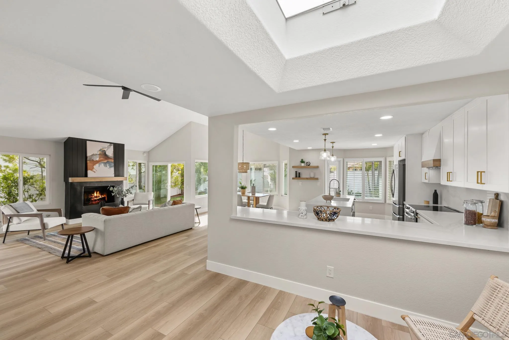 4661 Majorca Way Oceanside, CA 92056 - Photo 23 of 64 a living room with furniture and a large window