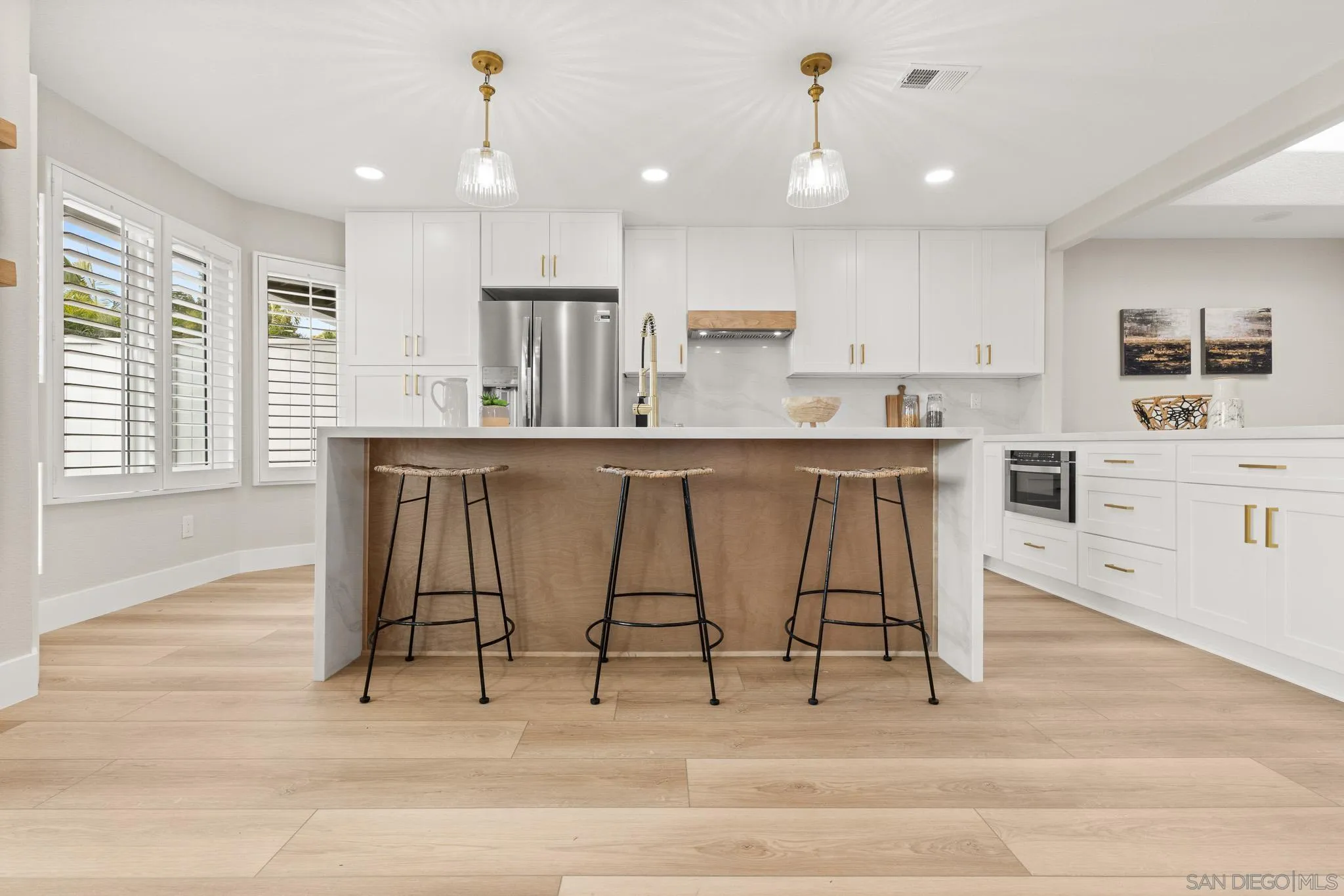 4661 Majorca Way Oceanside, CA 92056 - Photo 4 of 64 a view of kitchen with stainless steel appliances granite countertop dining table chairs sink and cabinets