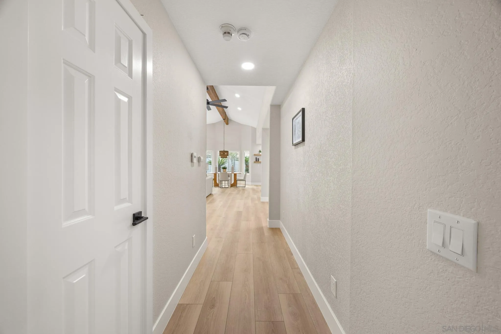 4661 Majorca Way Oceanside, CA 92056 - Photo 46 of 64 a view of a hallway with wooden floor and staircase