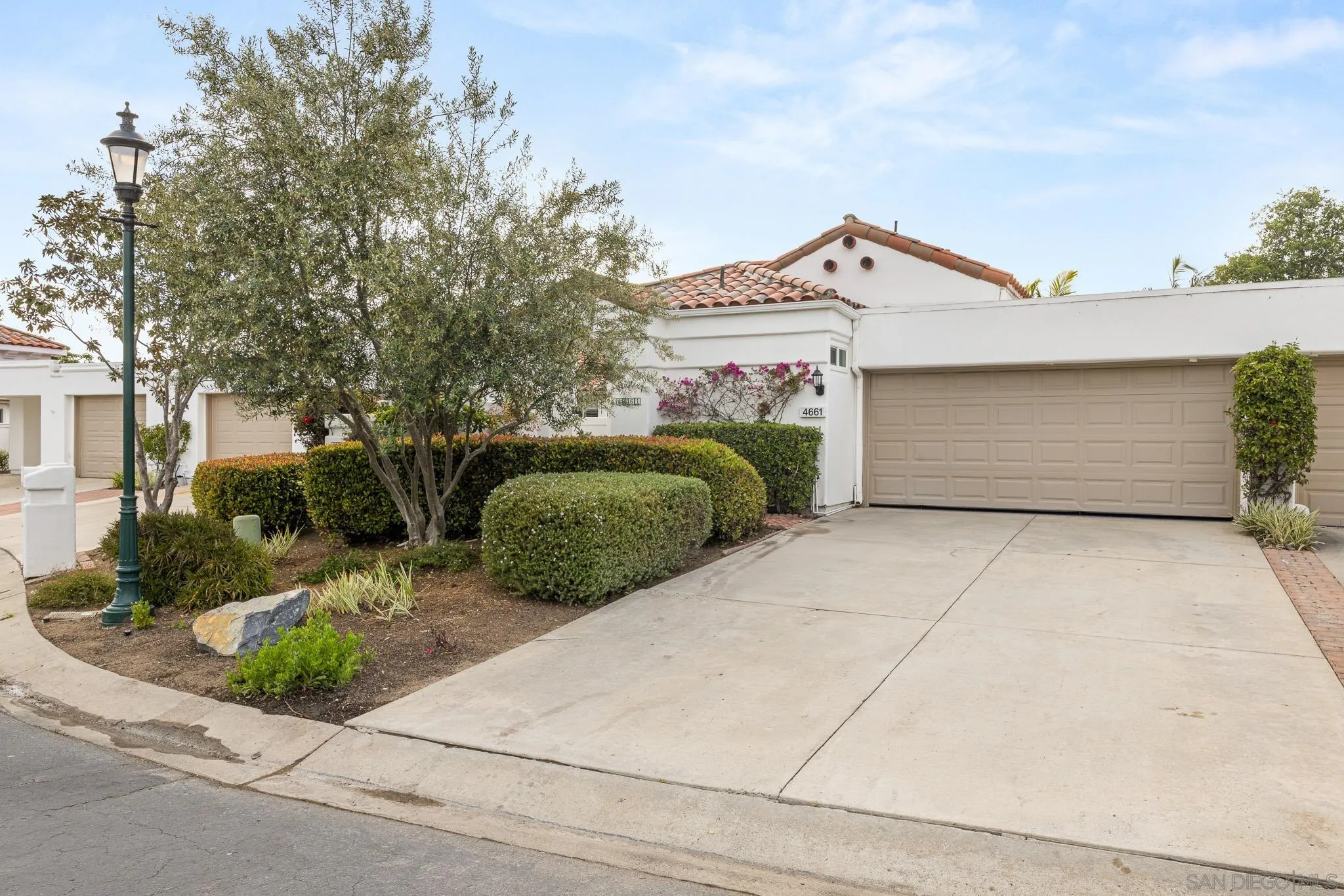 4661 Majorca Way Oceanside, CA 92056 - Photo 60 of 64 a view of a house with a yard and plants