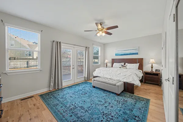 a bedroom with a large bed and a window