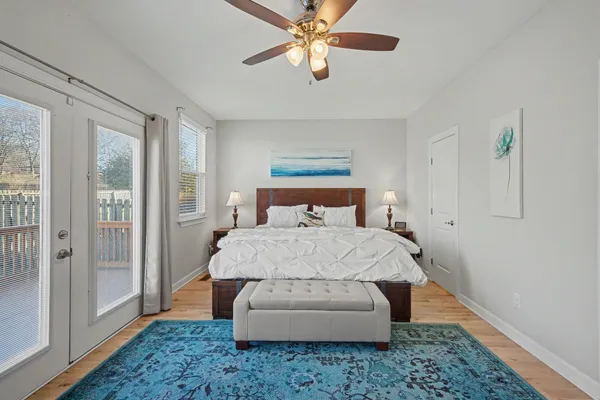 a bedroom with a bed and lamp