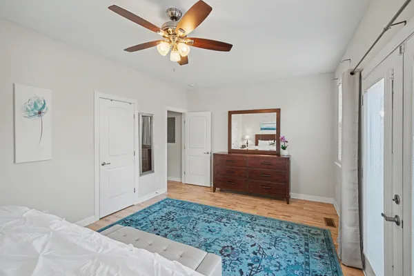 a bedroom with a bed and a dresser