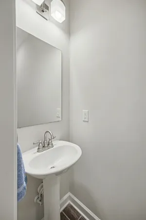 a bathroom with a sink and mirror