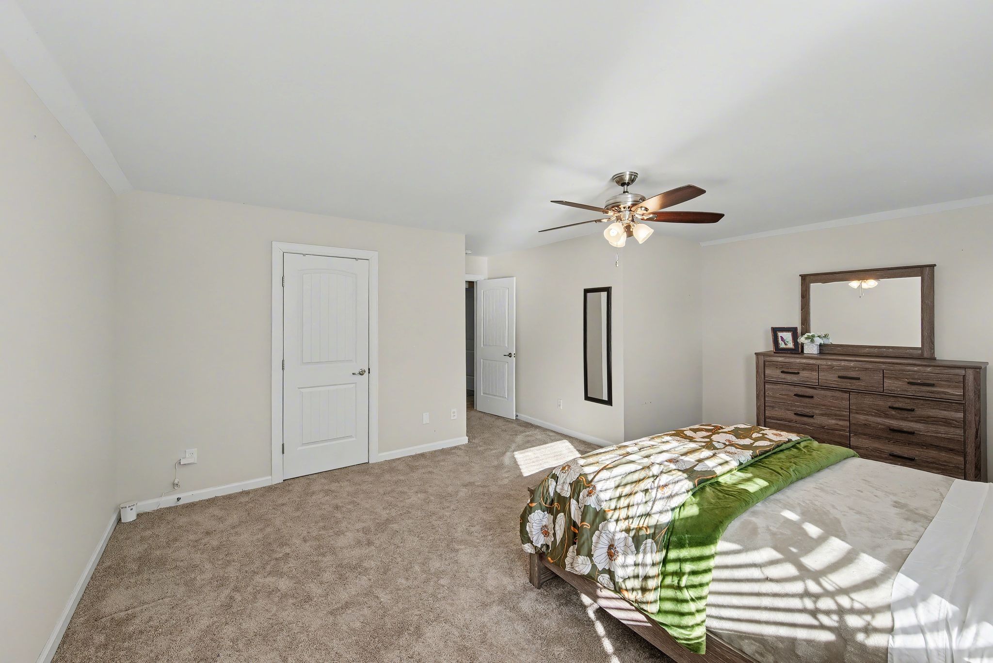 912 Pierce Road Madison, TN 37115 - Photo 23 of 32 a bedroom with a bed and a chandelier