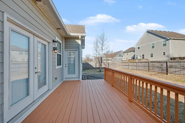 a view of balcony with wooden floor