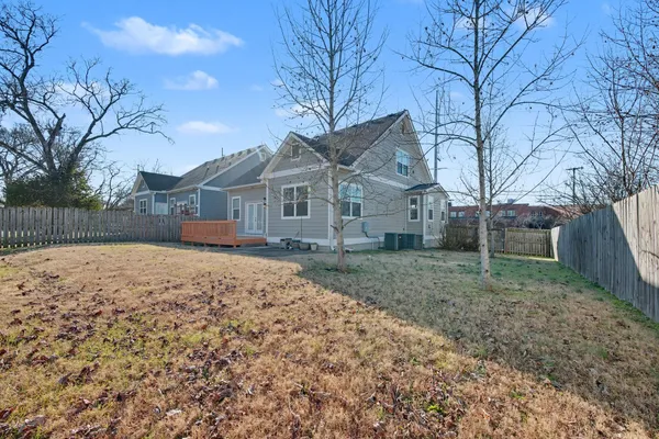 a view of a house with a yard covered with snow