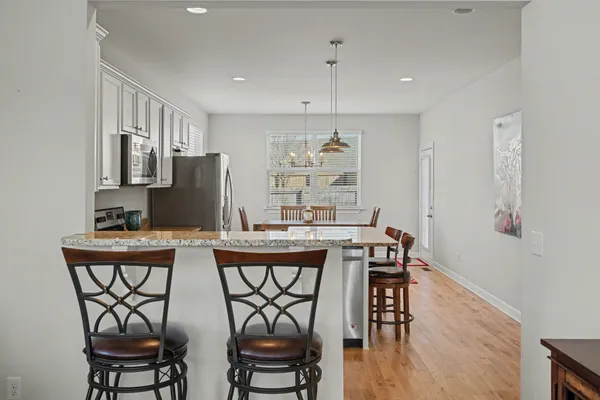 a view of a dining room with furniture wooden floor and breakfast area