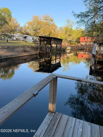 a building outdoor space with patio furniture and potted plants
