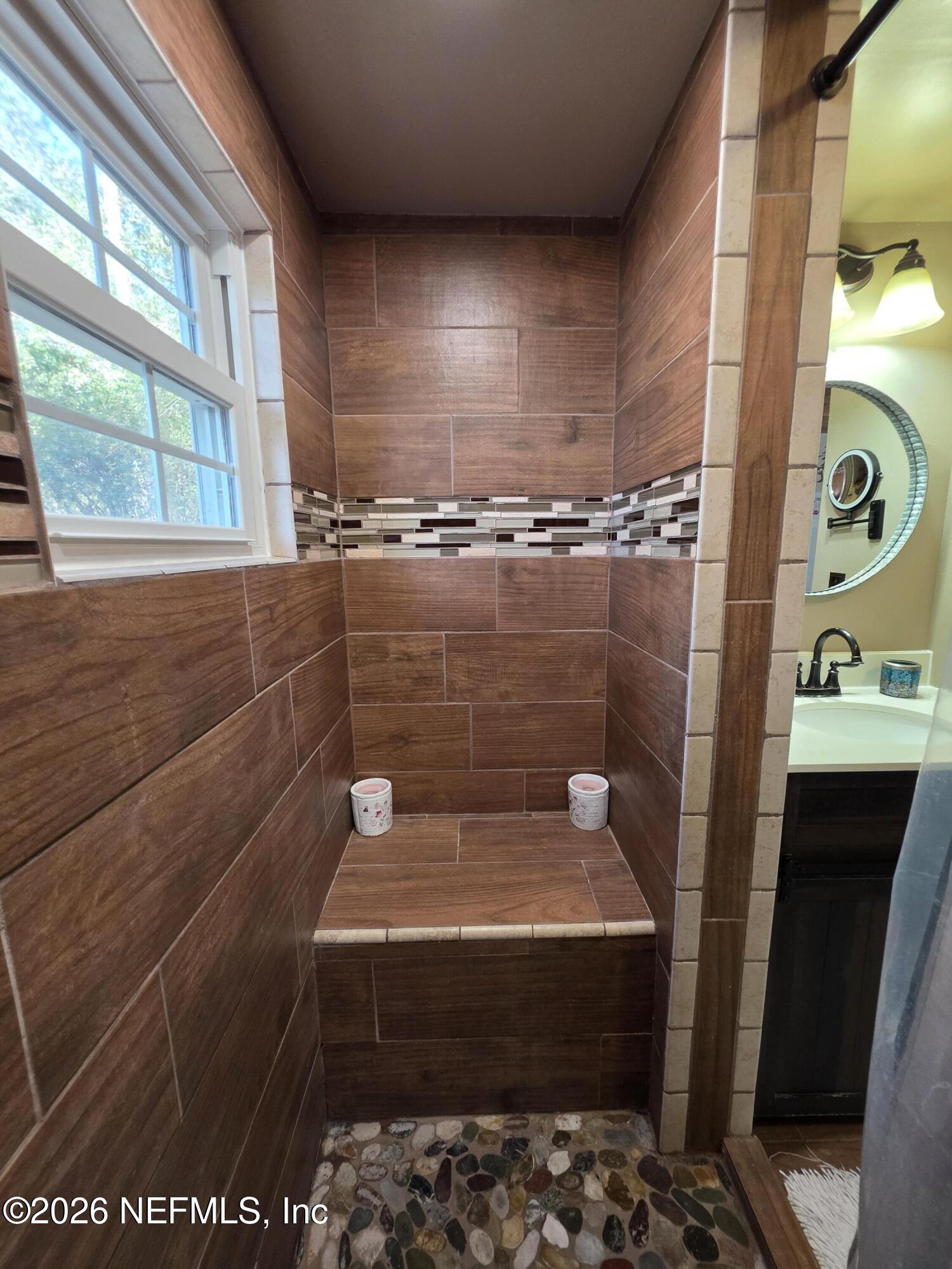 108 Creekside Road Satsuma, FL 32189 - Photo 34 of 51 a bathroom with a sink and a mirror