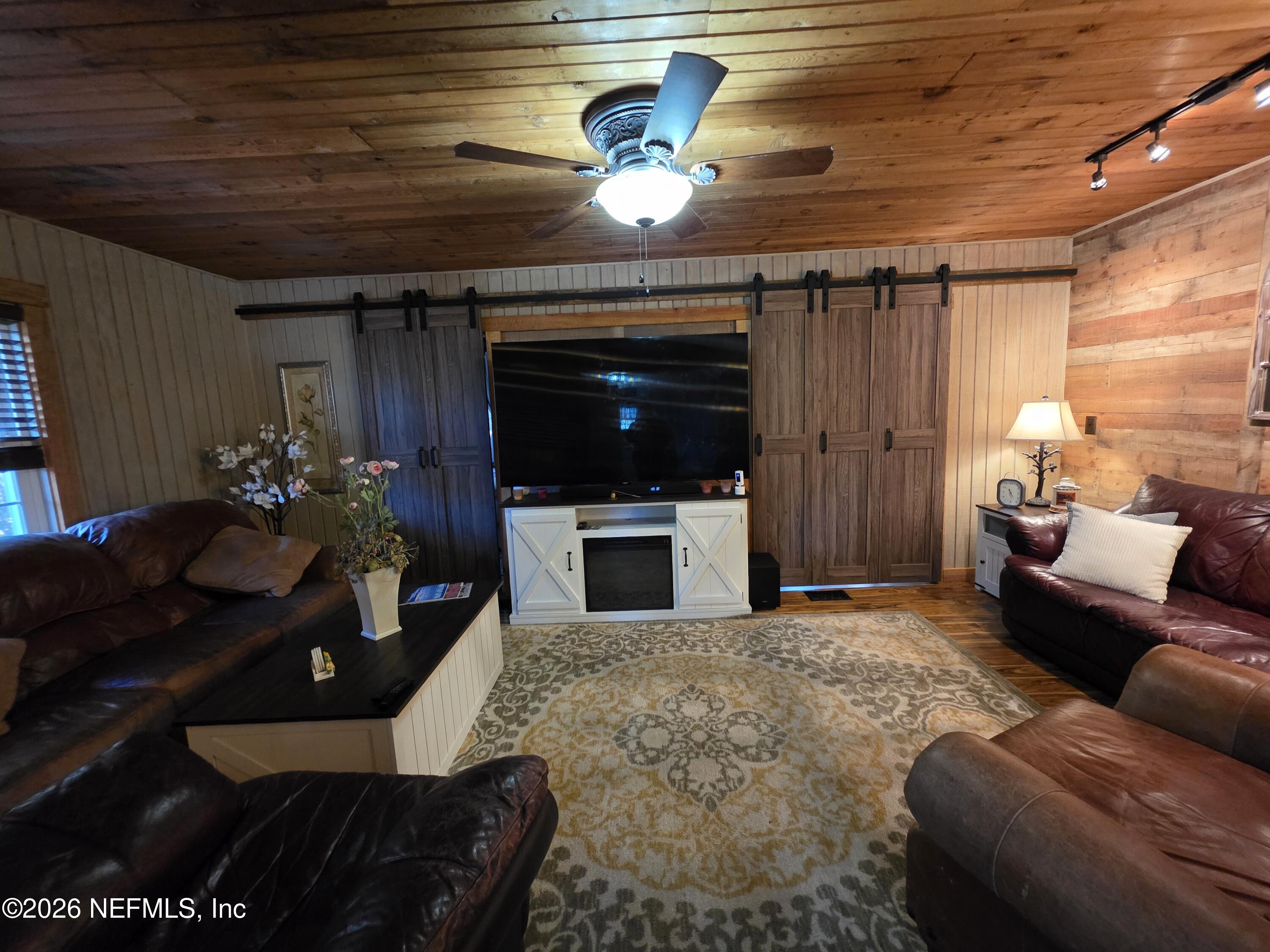 108 Creekside Road Satsuma, FL 32189 - Photo 36 of 51 a living room with furniture and a fireplace