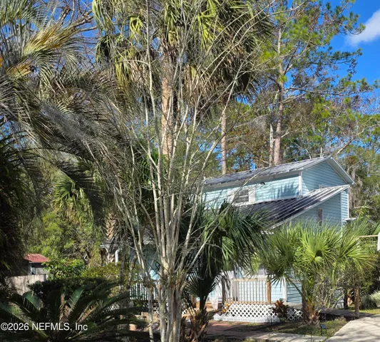 a outdoor space with patio the couches and a dining table with garden view
