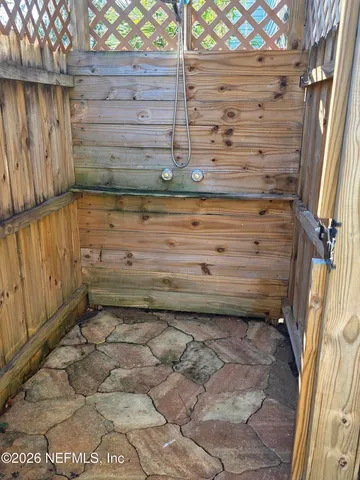 a bathroom with a sink a mirror and shower