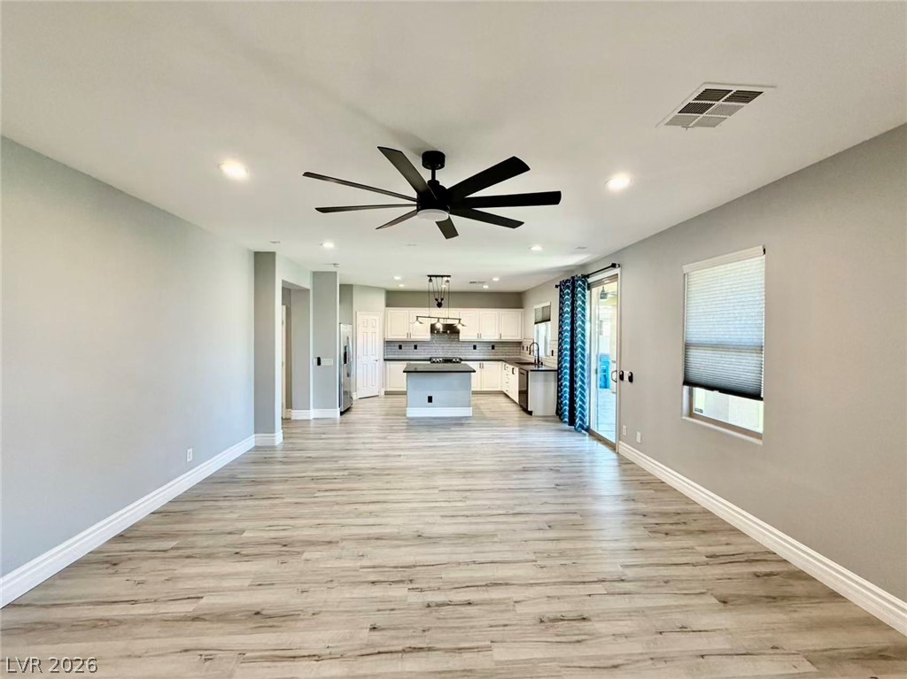 135 Tall Ruff Drive Las Vegas, NV 89148 - Photo 29 of 29 An open floorplan seamlessly connects the living area to a well-appointed kitchen.
