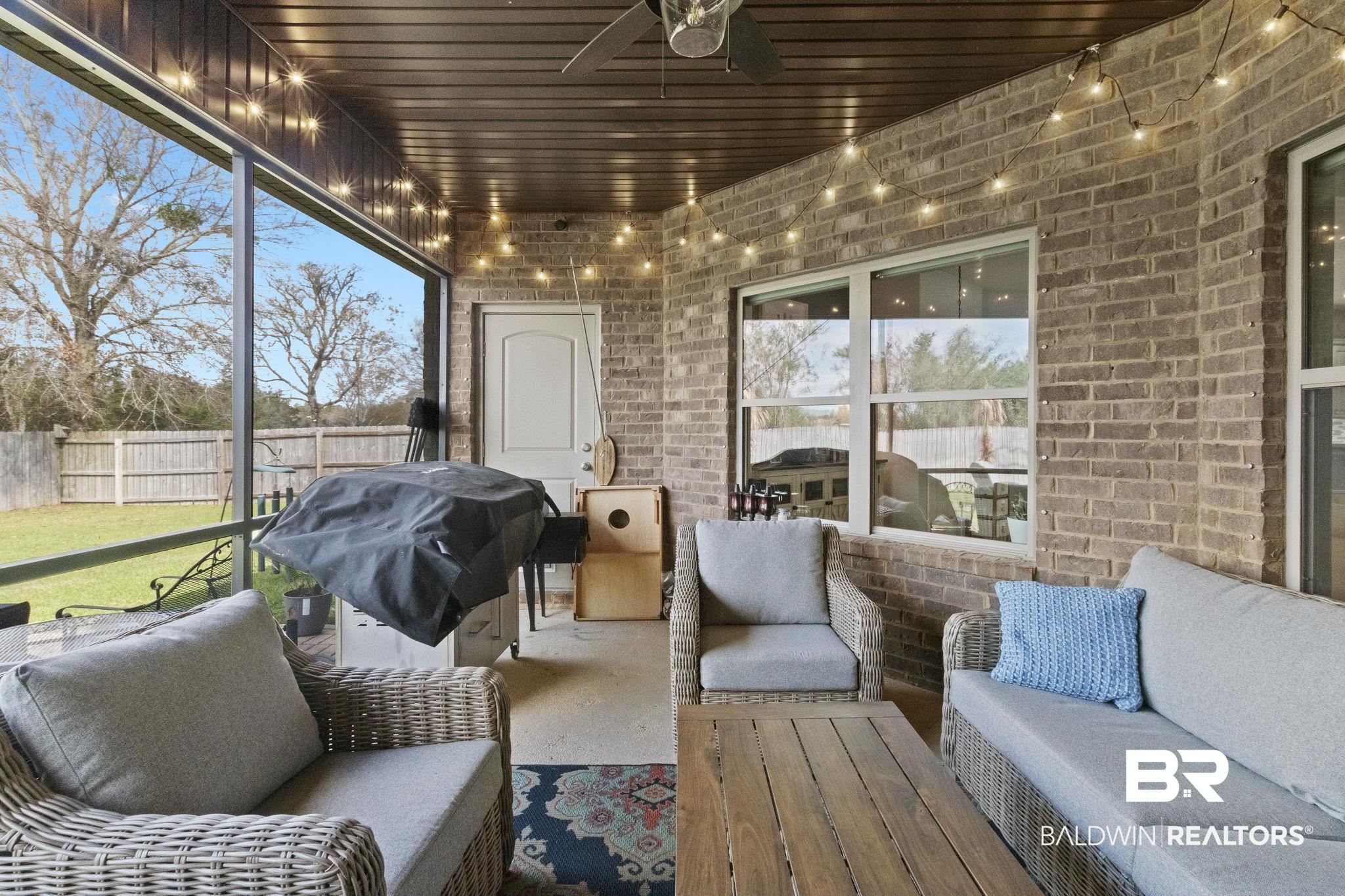 7051 Rocky Rd Loop Gulf Shores, AL 36542 - Photo 23 of 27 Sunroom featuring wooden ceiling and a healthy amount of sunlight