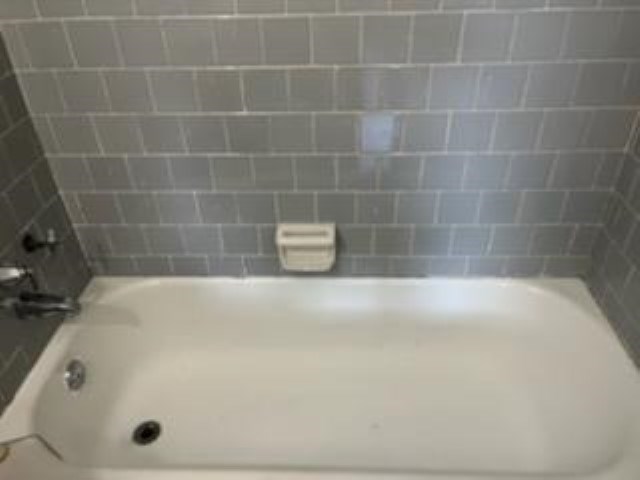 2334 Fort Benning Road, Unit 1 Columbus, GA 31903 - Photo 11 of 11 a bathroom with a white bath tub