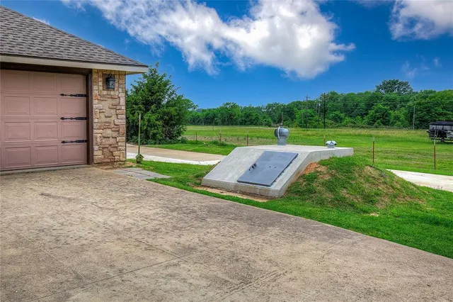 a view of a backyard with large trees