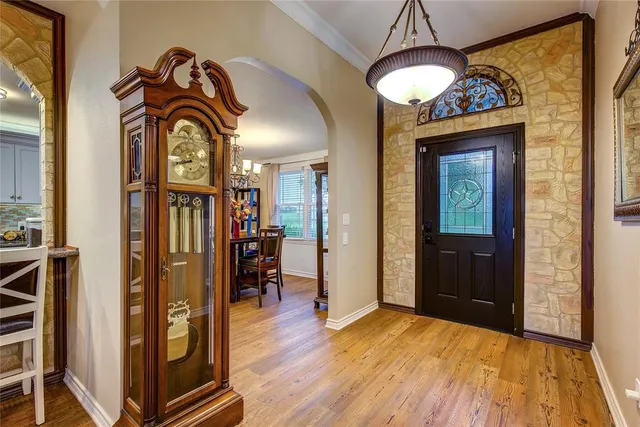 a view of a entryway door with wooden floor