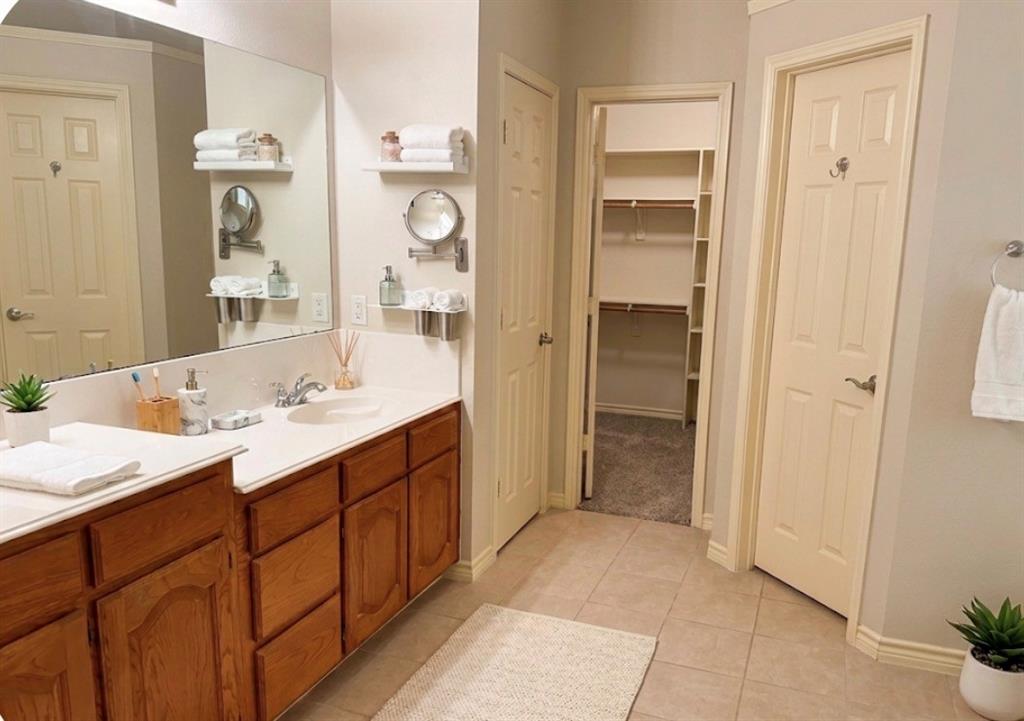 4214 Glistening Spring Rowlett, TX 75088 - Photo 26 of 32 Primary bath virtually staged