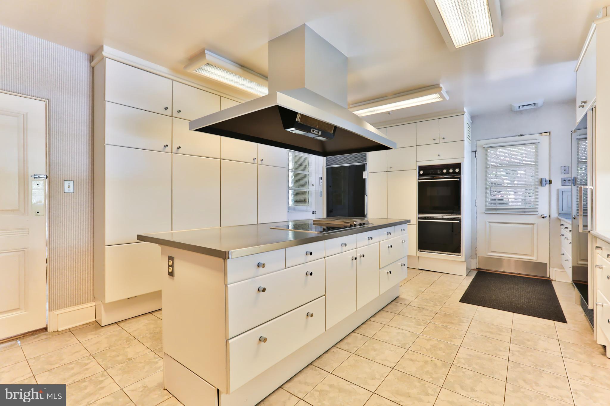 3408 Old Court Road Baltimore, MD 21208 - Photo 12 of 30 Kitchen with Stainless Steel Island