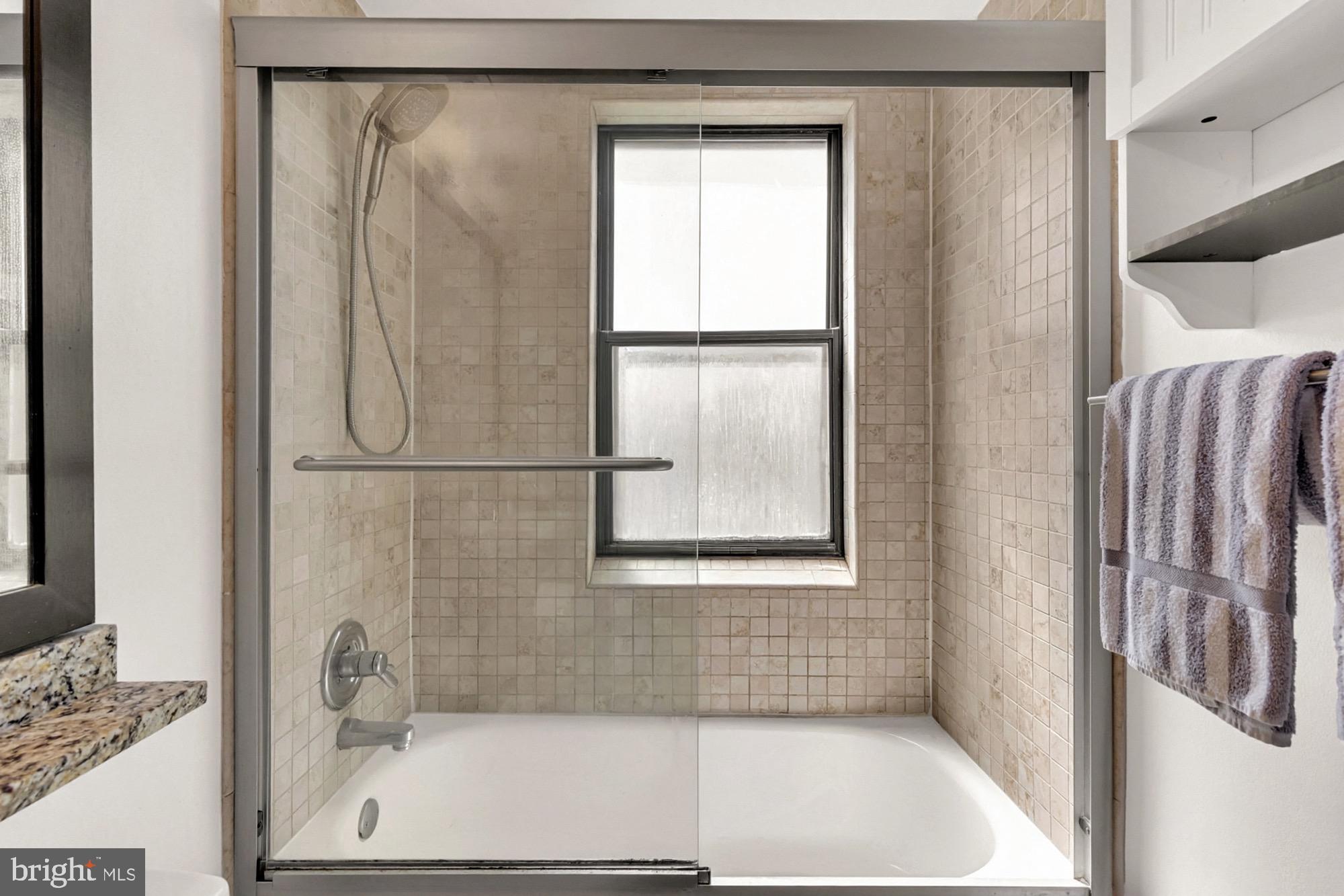 1727 R Street Northwest, Unit 402 Washington, DC 20009 - Photo 23 of 35 Bright Windowed Bathroom with Tub/Shower