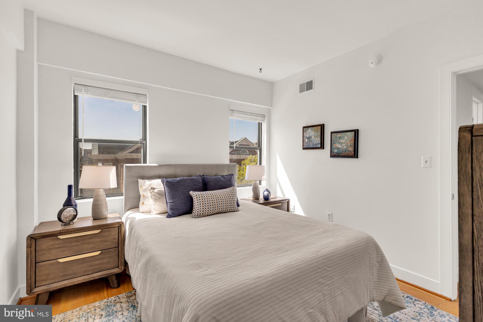 1727 R Street Northwest, Unit 402 Washington, DC 20009 - Photo 26 of 37 a bedroom with a bed and a night stand
