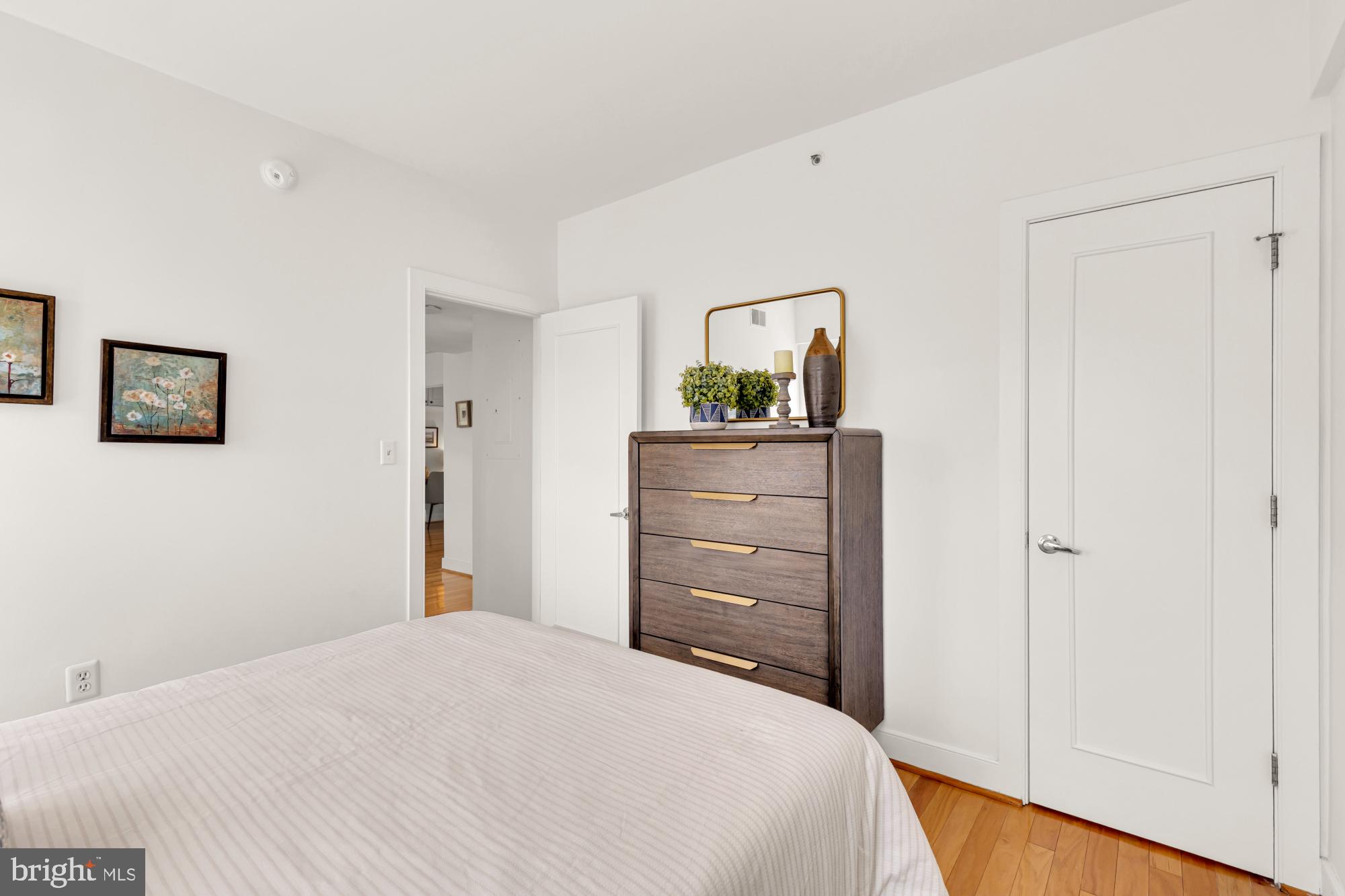 1727 R Street Northwest, Unit 402 Washington, DC 20009 - Photo 28 of 37 a bedroom with a bed and a dresser