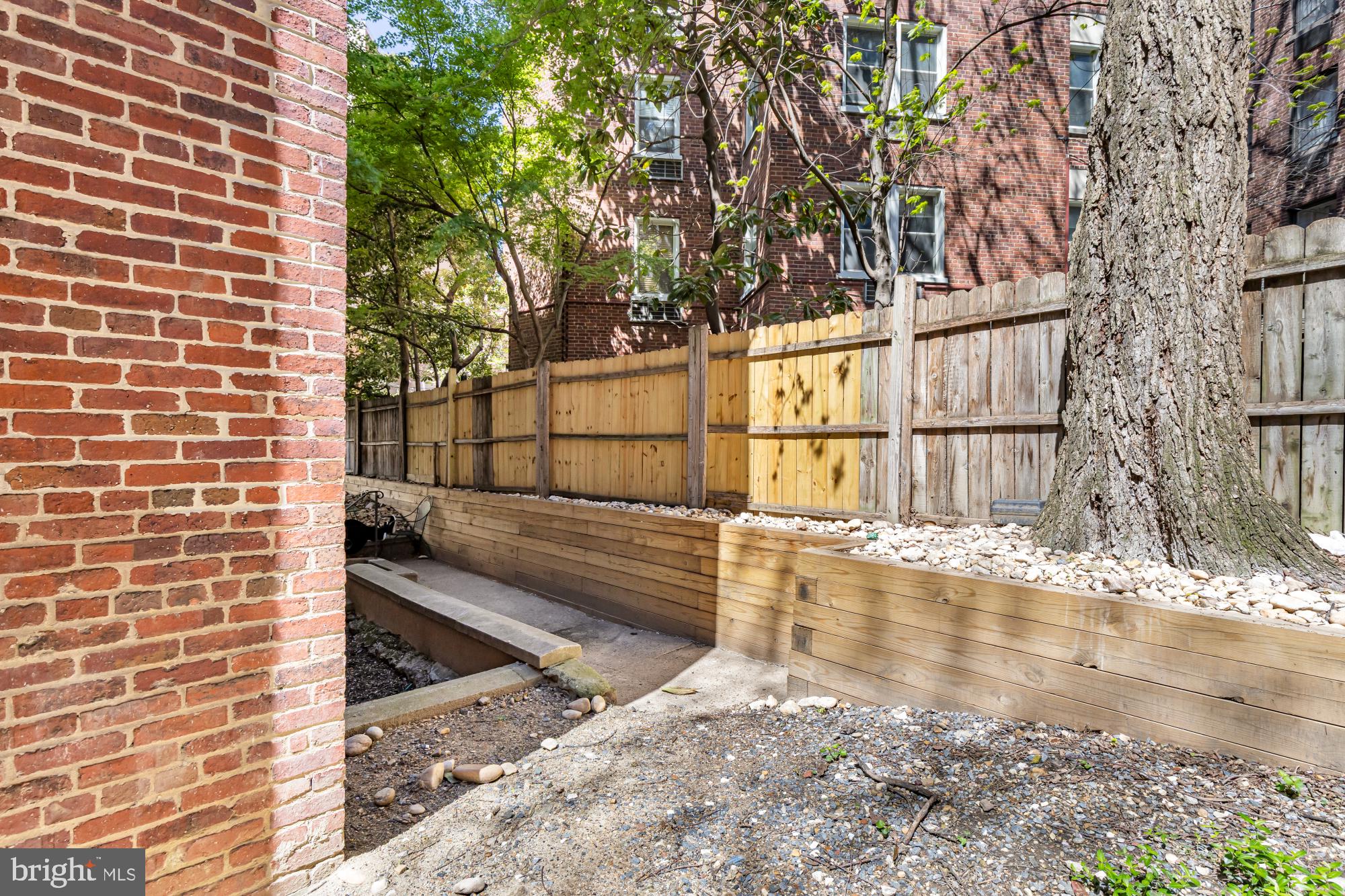 1727 R Street Northwest, Unit 402 Washington, DC 20009 - Photo 34 of 37 a view of a pathway with a bench in front of house