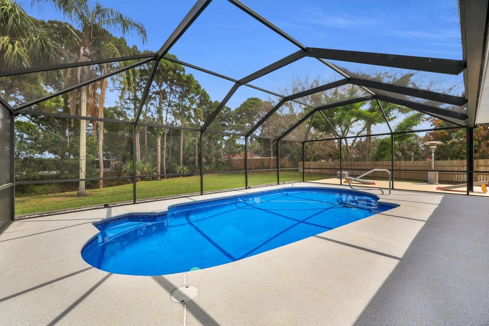 1950 Southwest Logwood Road Port St. Lucie, FL 34953 - Photo 25 of 32 a view of indoor pool and porch