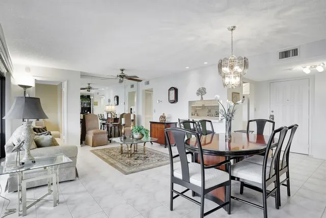 a kitchen with stainless steel appliances a sink and a refrigerator