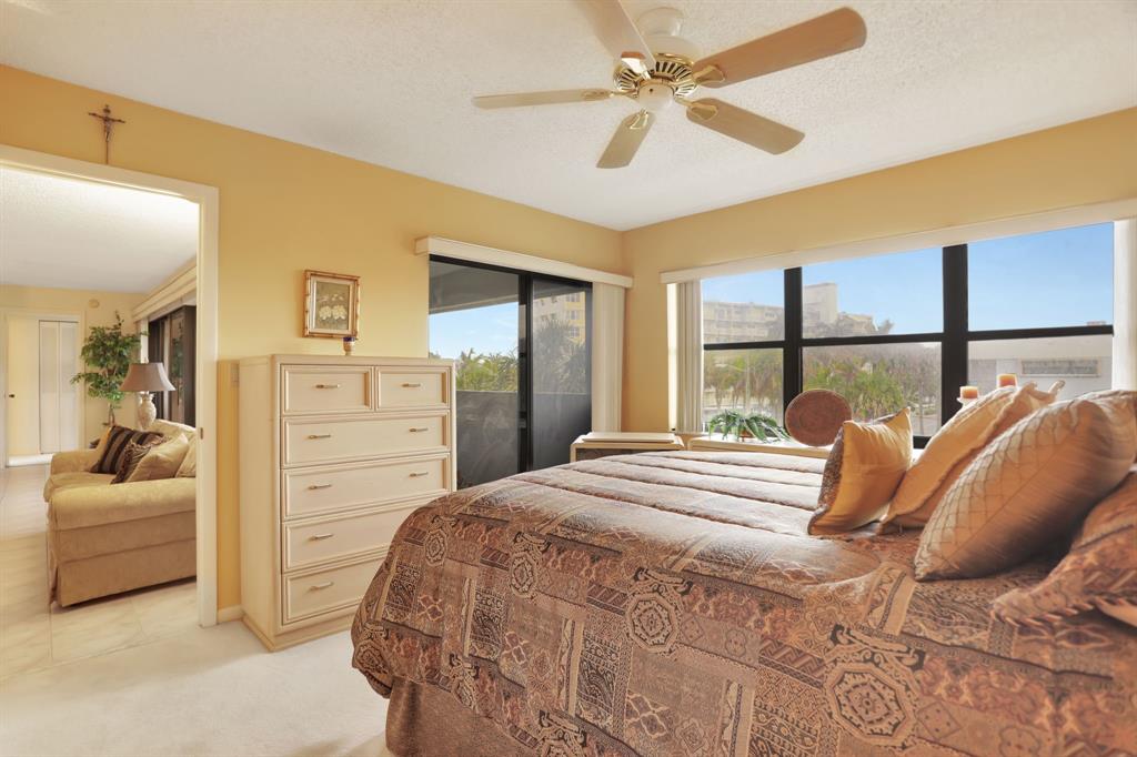 330 Southeast 20th Avenue, Unit 307 Deerfield Beach, FL 33441 - Photo 28 of 48 a bedroom with a bed and a couch