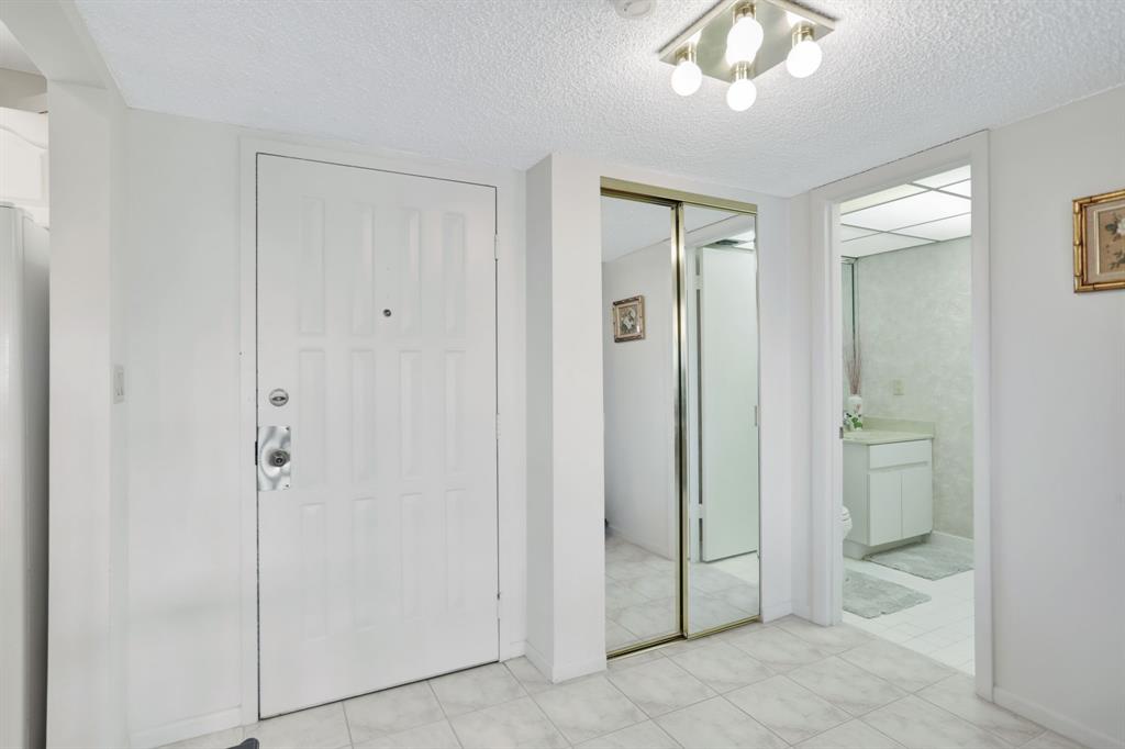 330 Southeast 20th Avenue, Unit 307 Deerfield Beach, FL 33441 - Photo 9 of 48 a view of a bathroom with a glass door shower