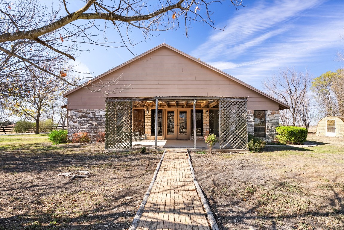 12914 Pfluger Berkman Road Coupland, TX 78615 - Photo 2 of 39 a front view of a house with a yard