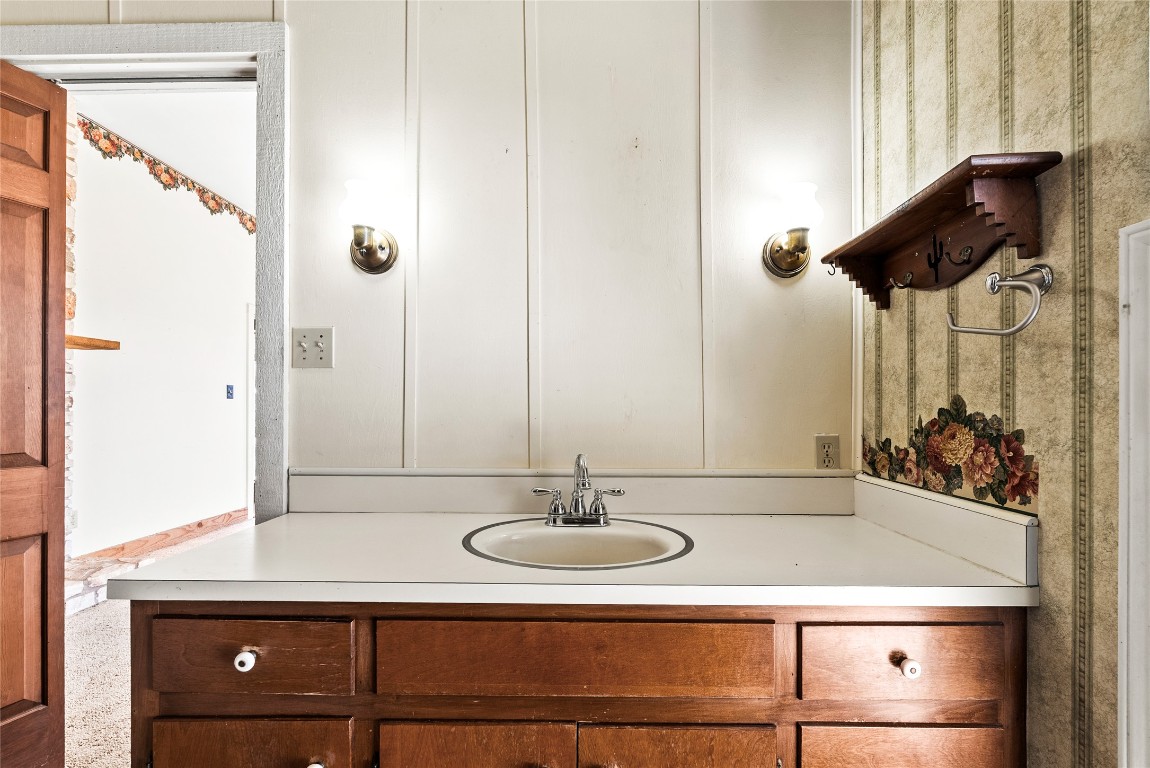 12914 Pfluger Berkman Road Coupland, TX 78615 - Photo 24 of 39 a bathroom with a sink and a mirror