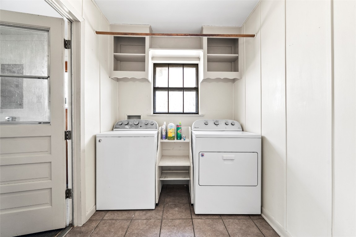 12914 Pfluger Berkman Road Coupland, TX 78615 - Photo 28 of 39 a utility room with cabinets washer and dryer