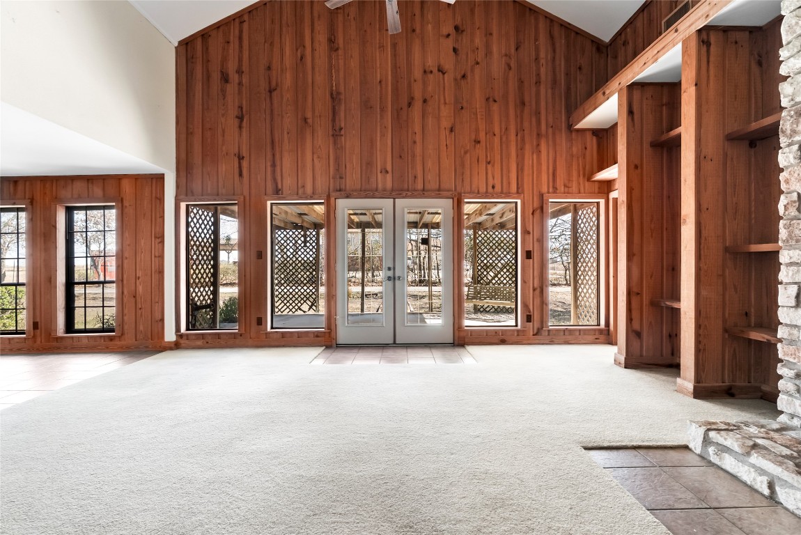 12914 Pfluger Berkman Road Coupland, TX 78615 - Photo 4 of 39 a view of a room with large windows and furniture