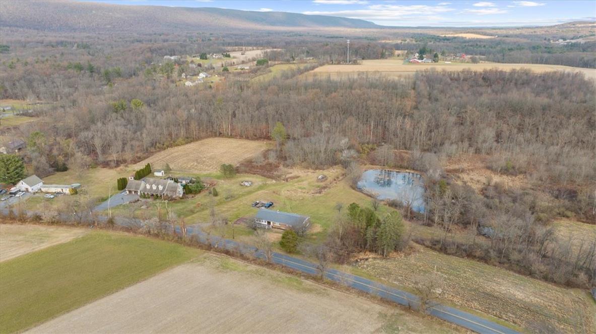 988 Hoch Road Danielsville, PA 18038 - Photo 24 of 29 Expansive acreage features a private pond and scenic views of the distant mountains.
