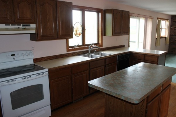 500 Hadley Road Sunderland, MA 01375 - Photo 10 of 22 a kitchen with a stove a sink and a cabinets