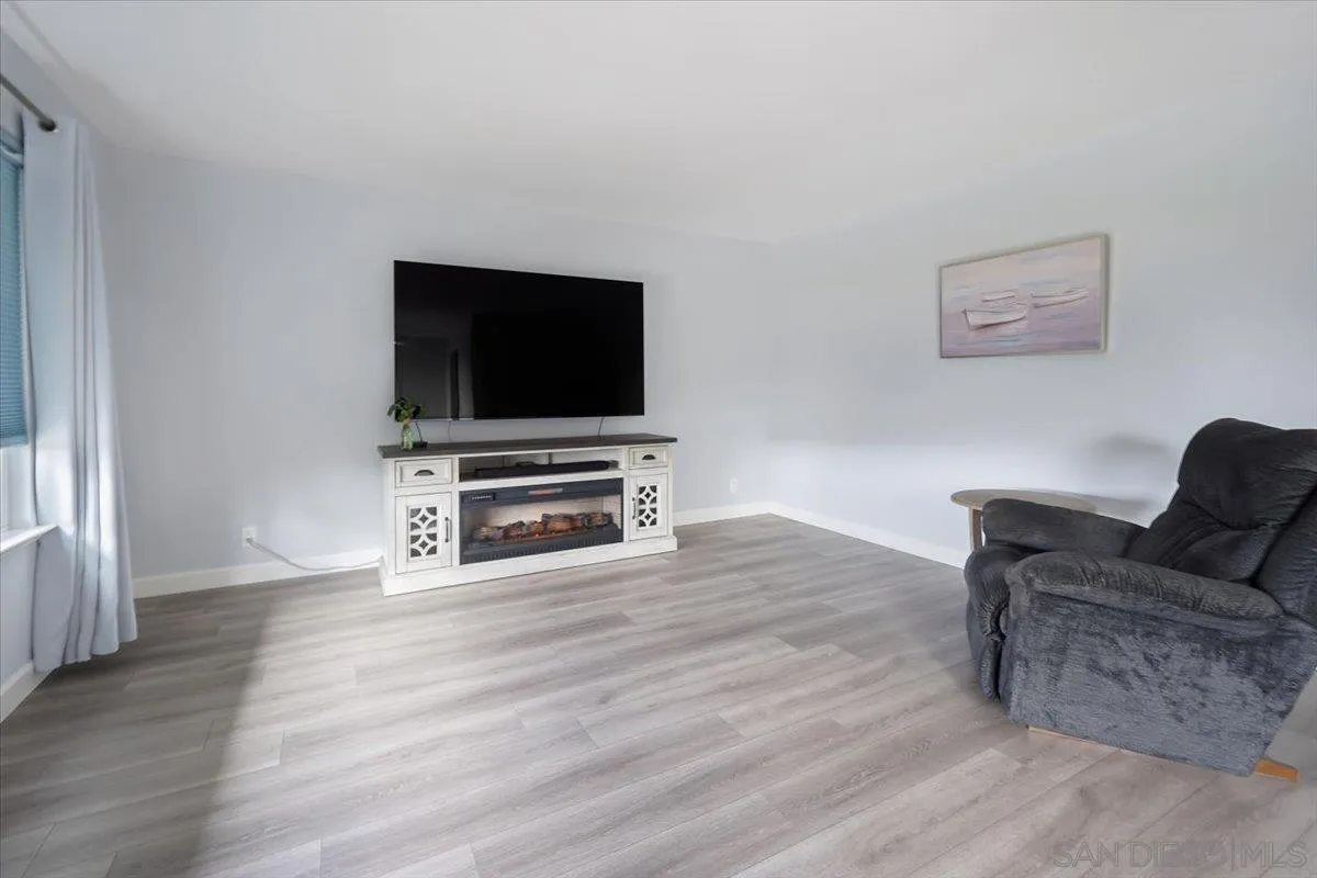 4436 Skimmer Way Oceanside, CA 92057 - Photo 12 of 71 a living room with furniture and a flat screen tv