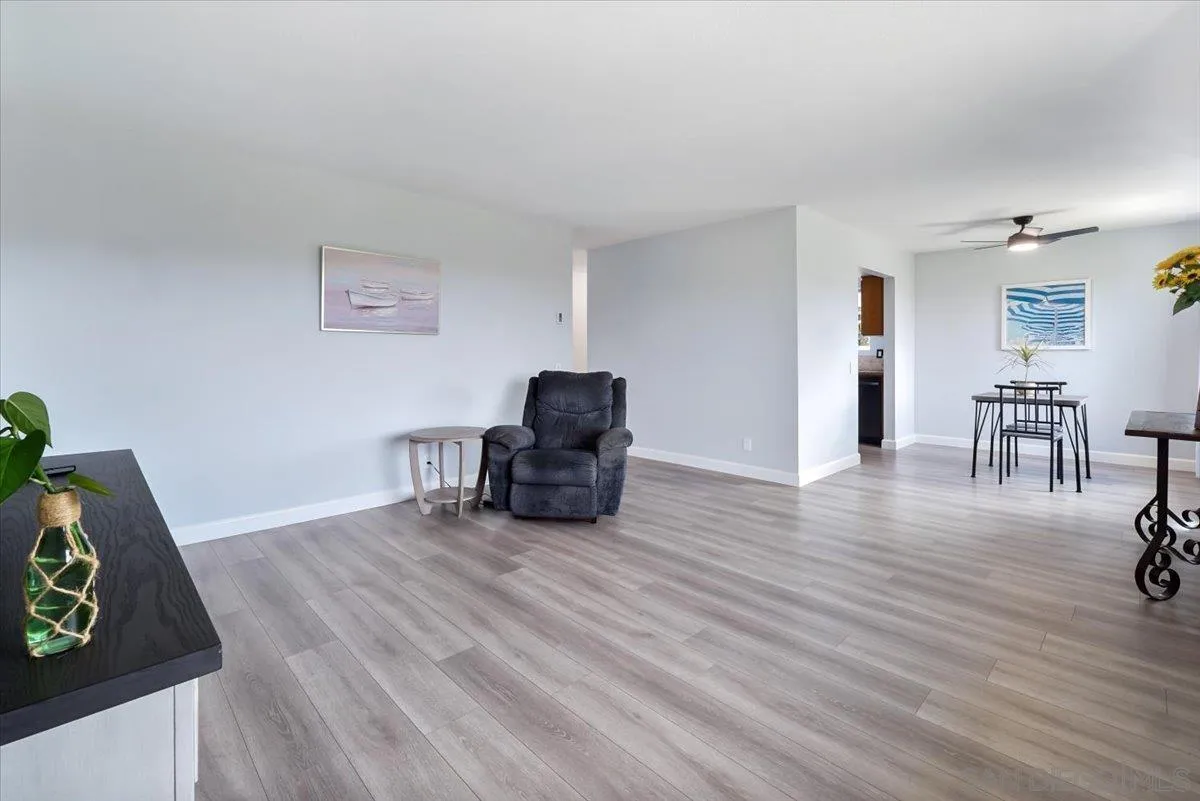 4436 Skimmer Way Oceanside, CA 92057 - Photo 14 of 71 a living room with furniture and a wooden floor