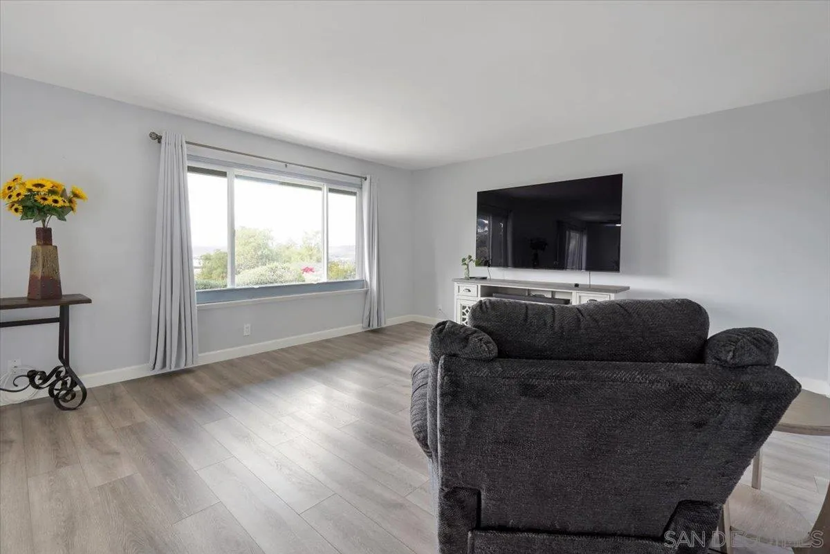 4436 Skimmer Way Oceanside, CA 92057 - Photo 15 of 71 a living room with furniture and a flat screen tv