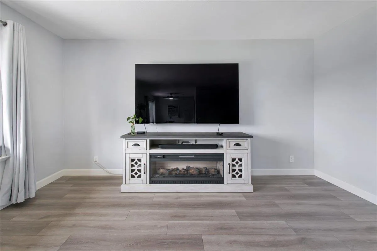 4436 Skimmer Way Oceanside, CA 92057 - Photo 16 of 71 a living room with a stove and a microwave