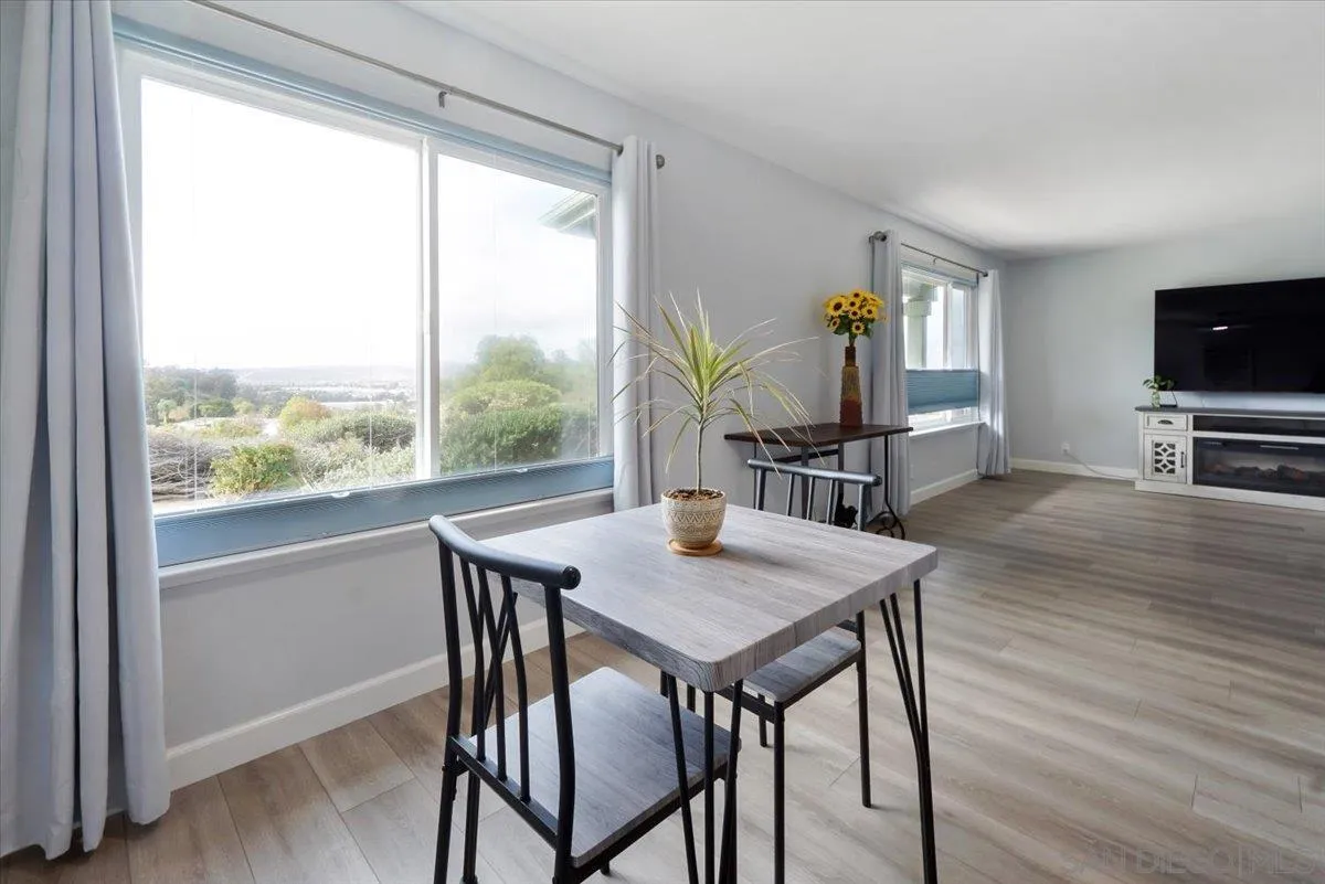 4436 Skimmer Way Oceanside, CA 92057 - Photo 17 of 71 a view of a dining room with furniture window and wooden floor