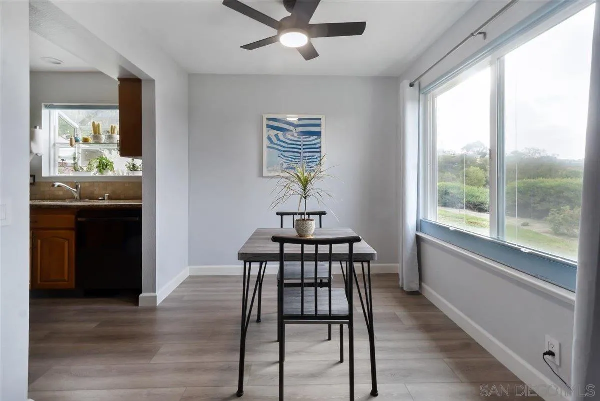4436 Skimmer Way Oceanside, CA 92057 - Photo 18 of 71 a view of a dining room with furniture window and wooden floor
