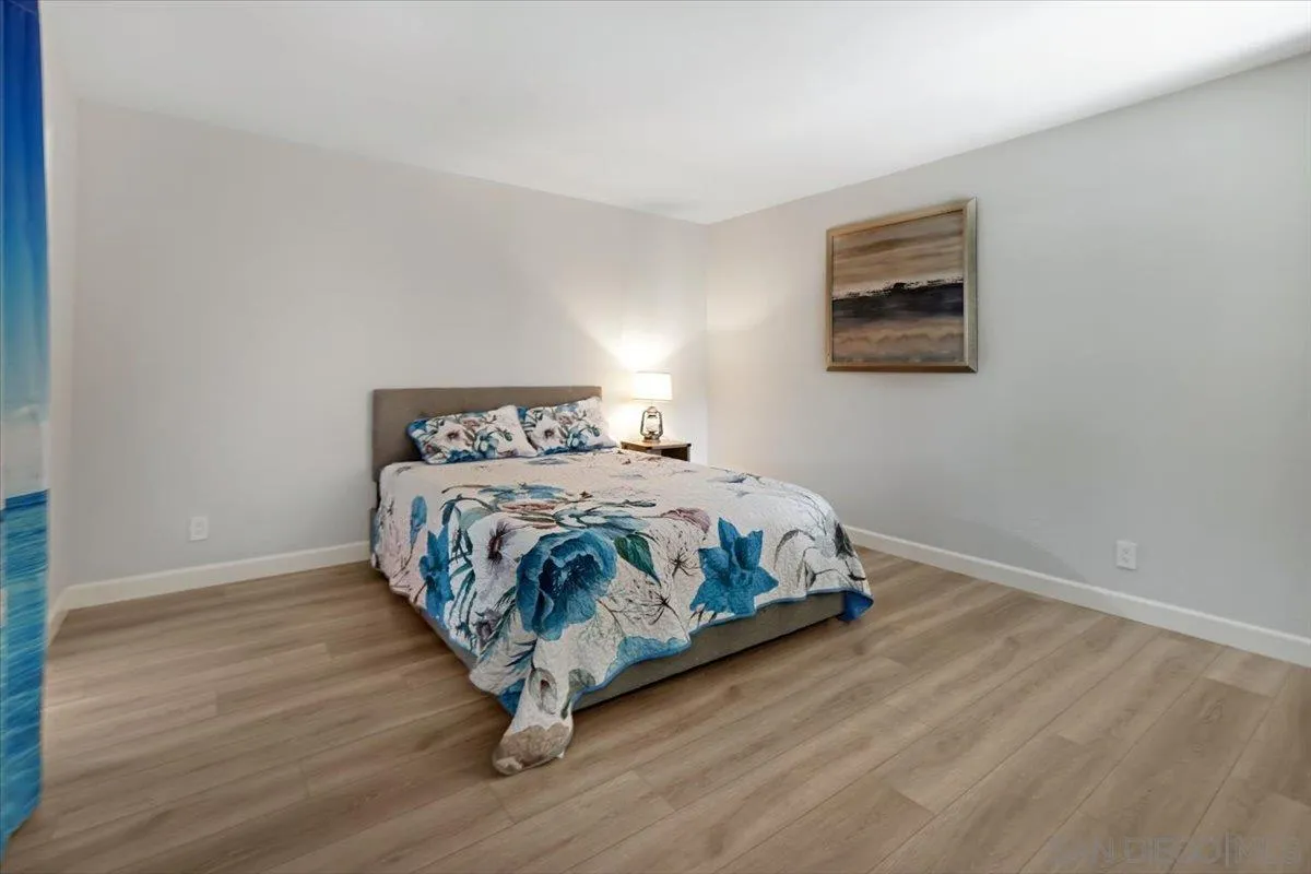 4436 Skimmer Way Oceanside, CA 92057 - Photo 20 of 71 a bedroom with a bed and painting on the wall