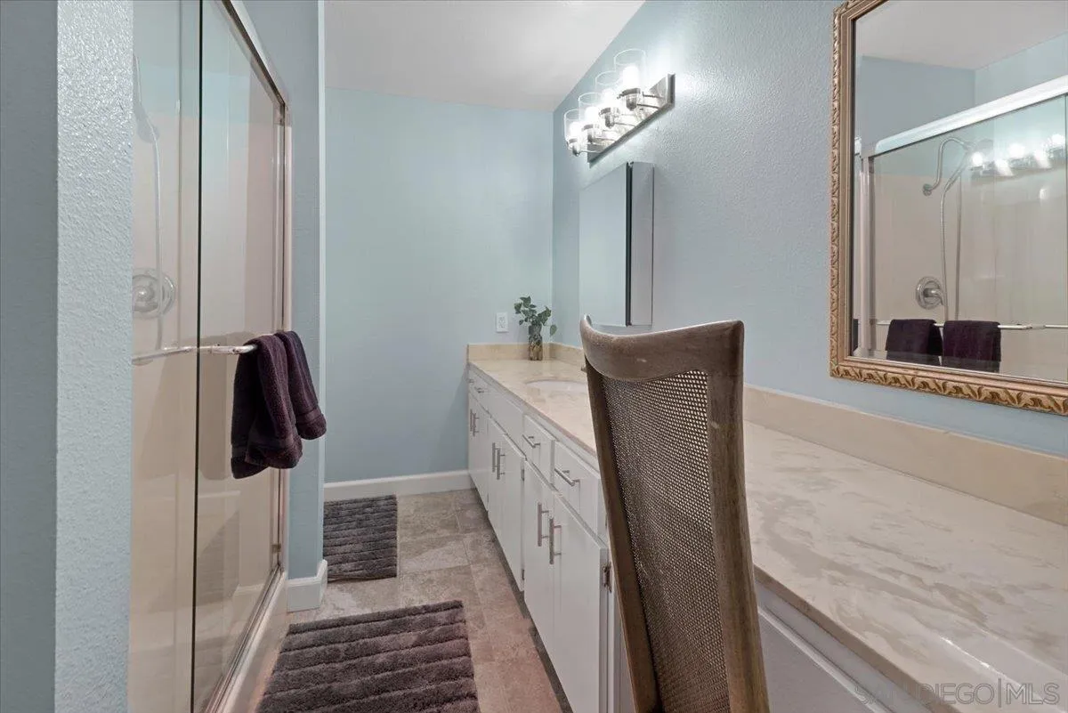 4436 Skimmer Way Oceanside, CA 92057 - Photo 23 of 71 a bathroom with a sink and mirror