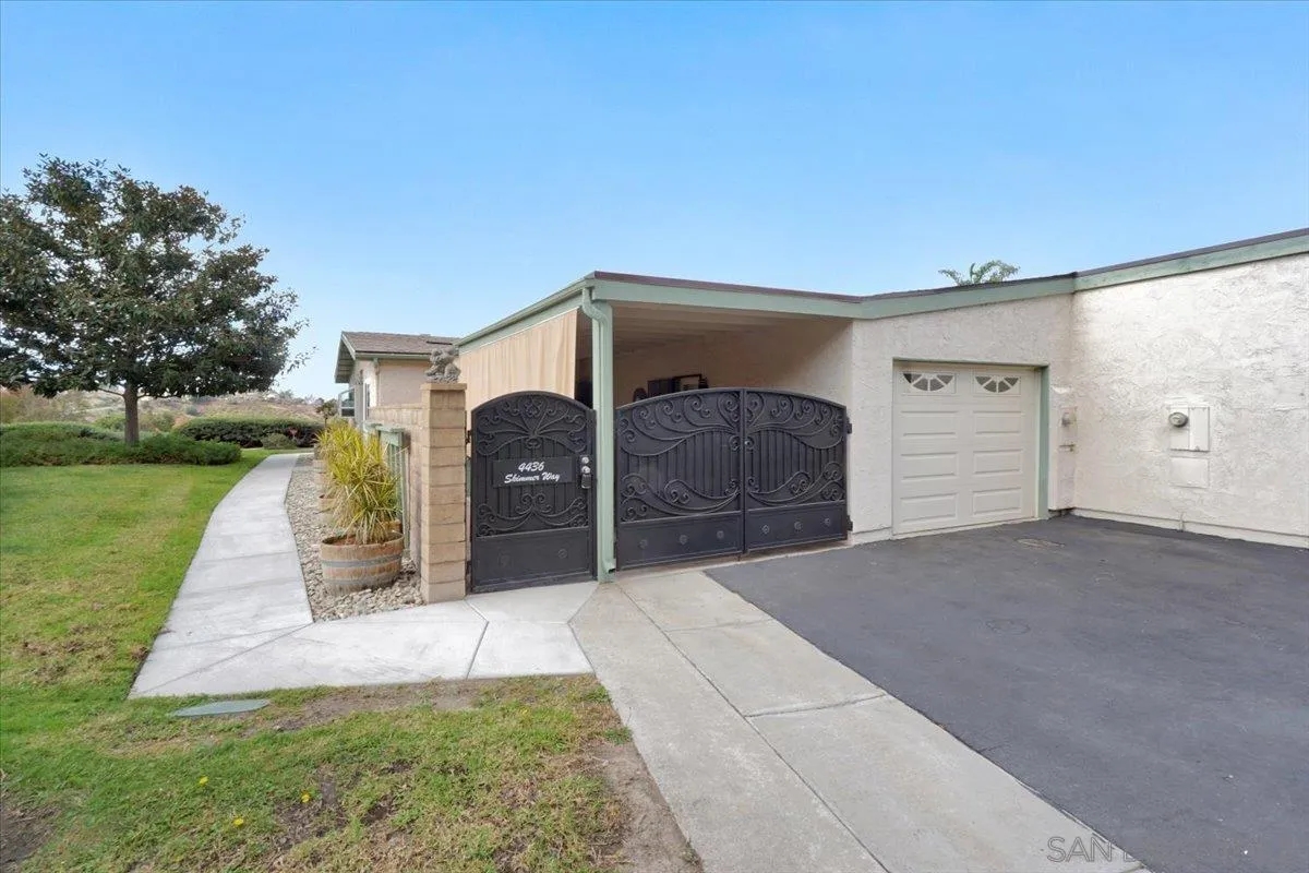 4436 Skimmer Way Oceanside, CA 92057 - Photo 30 of 71 a front view of a house with a yard and garage
